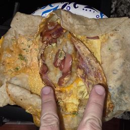 Breakfast burrito that should have had 3 eggs apple sausage 3 bacon and tots actually has 1.5 eggs? 2 bacon, a hot dog and cubes potatoes Breakfast burrito that should have had 3 eggs apple sausage 3 bacon and tots actually has 1.5 eggs? 2 bacon, a hot dog and cubes potatoes