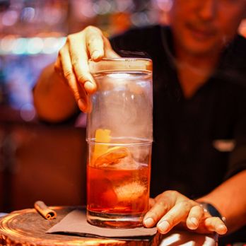 Lonigan's - a man pouring a drink - Karaoke Near Me - Estes Park, Colorado Lonigan's - a man pouring a drink - Karaoke Near Me - Estes Park, Colorado