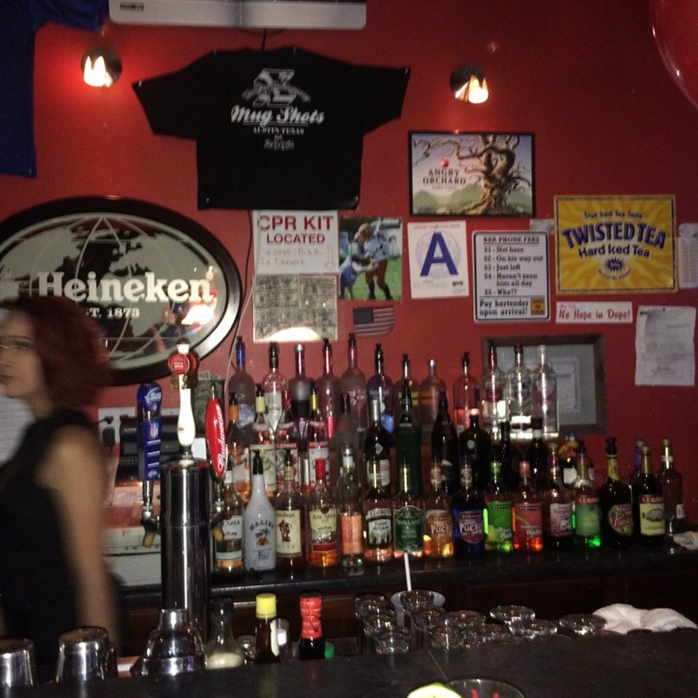 Mug Shots - a woman behind the bar - Bars Near Me - Staten Island, New York