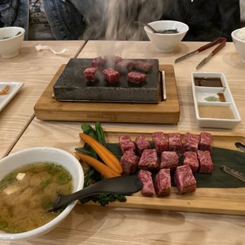 Gyu Jinya - Cooking the very tender ribeye steak on the hot stone. - Sushi Bars Near Me - Lancaster, California Gyu Jinya - Cooking the very tender ribeye steak on the hot stone. - Sushi Bars Near Me - Lancaster, California