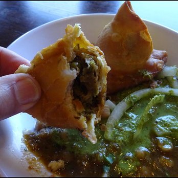 Tandoori Nights - I've eaten half a samosa... note the flaky, delicious, perfectly deep fried crust, and the amazing filling of potato, chickpea and onion. - Pakistani Near Me - Roseville, California