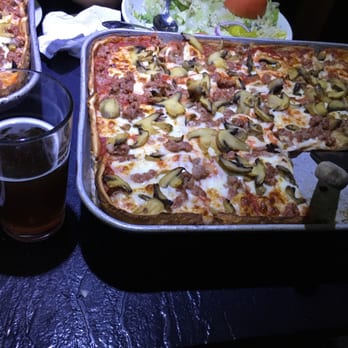 DeMarinis Pizzeria - Sausage, mushroom and onion--the pizza here is on point! Paired with a Riverwest Stein. - Pizza Near Me - Menomonee Falls, Wisconsin