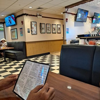 Big City Diner - a man reading a menu - Diners Near Me - Kaneohe, Hawaii Big City Diner - a man reading a menu - Diners Near Me - Kaneohe, Hawaii