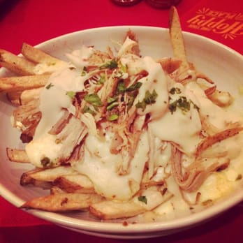 Q Kitchen | Bar - Texas style poutine with cheddar cheese curds, gravy, and pulled pork on a bed of fries - Barbeque Near Me - San Antonio, Texas Q Kitchen | Bar - Texas style poutine with cheddar cheese curds, gravy, and pulled pork on a bed of fries - Barbeque Near Me - San Antonio, Texas