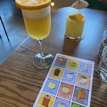 Amano - Drinks  Mexi -mimosa  La playa ( umbrella) - Cocktail Bars Near Me - Caldwell, Idaho