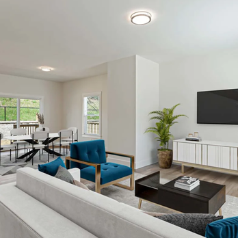 Belle Meadow - Open-concept living and dining area in a Belle Meadow home in Asheville, NC with wood-look floors and modern furnishings. - Apartments Near Me - Asheville, North Carolina Belle Meadow - Open-concept living and dining area in a Belle Meadow home in Asheville, NC with wood-look floors and modern furnishings. - Apartments Near Me - Asheville, North Carolina