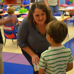 SPS Kindergarten teacher, Michelle Comstock, greets her class with a smile on the first day of school.