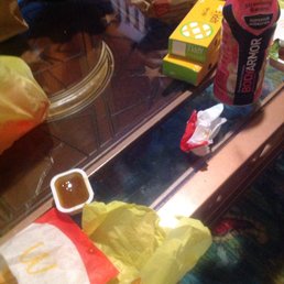 a coffee cup, soda, and other items on a table a coffee cup, soda, and other items on a table