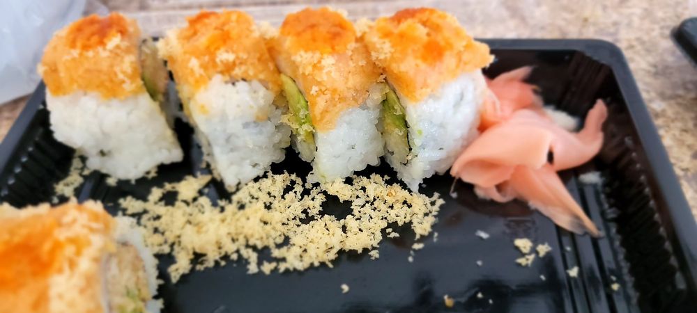 Rikaku Hibachi Express & Sushi Logo