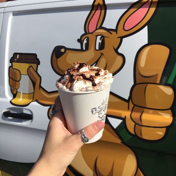 Hopping Aussie Coffee - a kangaroo holding a cup of coffee - Coffee & Tea Near Me