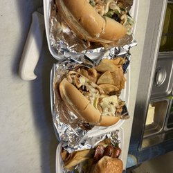 Torrance Brew Yard - Philly cheesesteak and chicken Philly  special Doug'cheesburger...