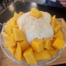 They said a dollar for mochi lol. No toppings other than the mango