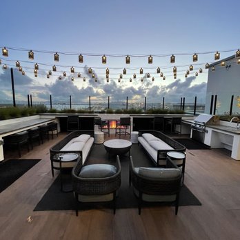 Aero Apartments - Deck at dusk - Apartments Near Me - Alameda, California Aero Apartments - Deck at dusk - Apartments Near Me - Alameda, California