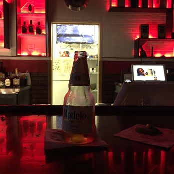 Masters Billards - a bottle of alcohol on a bar counter - Pool Halls Near Me - Margate, Florida Masters Billards - a bottle of alcohol on a bar counter - Pool Halls Near Me - Margate, Florida