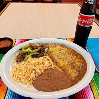 Con Amor Cocina - a plate of mexican food and a bottle of coke - Mexican Near Me - San Antonio, Texas