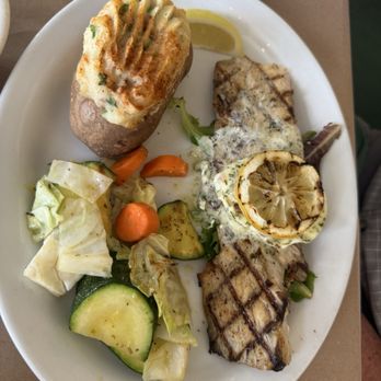 Eureka Sea Grill - Grilled Sea Bass with cilantro butter and a grill lemon for a little Smokey flavor - Seafood Near Me - Eureka, California Eureka Sea Grill - Grilled Sea Bass with cilantro butter and a grill lemon for a little Smokey flavor - Seafood Near Me - Eureka, California