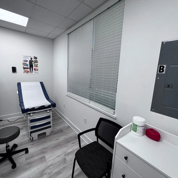 QuCiL Health™ - The image shows a compact and functional examination room at QuCiL Health™. A blue and white examination table with a gray st... - Weight Loss Centers Near Me - Brookshire, Texas QuCiL Health™ - The image shows a compact and functional examination room at QuCiL Health™. A blue and white examination table with a gray st... - Weight Loss Centers Near Me - Brookshire, Texas