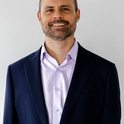 Flow Healing Arts  - Steven Budden  smiling in suit