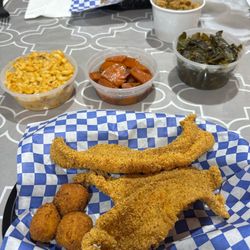 Fried catfish, hush puppies, mac-n-cheese, candies yams, collard greens, black eyed peas