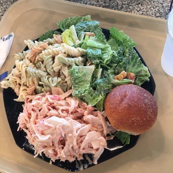 Cafe Max Richardson - Caesar salad, pasta salad, and seafood salad along with a multigrain roll. - New American Near Me - Richardson, Texas