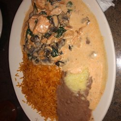 El Nopal - Adairsville - Chicken rice and beans covered in a marinated mushroom and spinach cheese sauce.