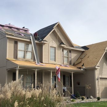 E L Construction - a house with a shingled roof - Painters Near Me - Kansas City, Missouri E L Construction - a house with a shingled roof - Painters Near Me - Kansas City, Missouri