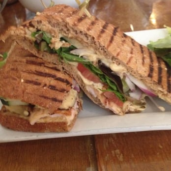 Pure Bistro - Mediterranean Panini Grilled chicken, mixed greens, tomato, cucumber, red onion & hummus on a multi-grain panini Yum! - Juice Bars & Smoothies Near Me - Brooklyn, New York Pure Bistro - Mediterranean Panini Grilled chicken, mixed greens, tomato, cucumber, red onion & hummus on a multi-grain panini Yum! - Juice Bars & Smoothies Near Me - Brooklyn, New York