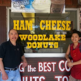 a man and a woman standing in front of a store