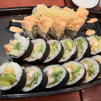 Sushi Katana - a platter of sushi with chopsticks - Sushi Bars Near Me - Orlando, Florida Sushi Katana - a platter of sushi with chopsticks - Sushi Bars Near Me - Orlando, Florida