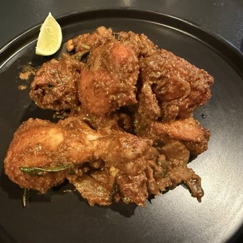 Namaste Nola - CHICKEN VEPUDU - tender bone-in chicken stir-fried with a medley of spices and curry leaves - Indian Near Me - New Orleans, Louisiana Namaste Nola - CHICKEN VEPUDU - tender bone-in chicken stir-fried with a medley of spices and curry leaves - Indian Near Me - New Orleans, Louisiana