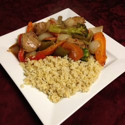 Cedar Valley Golf & Country Club - ASIAN PORK STIR FRY: Tender seasoned pork in spicy house asian sauce served on a bed of rice.