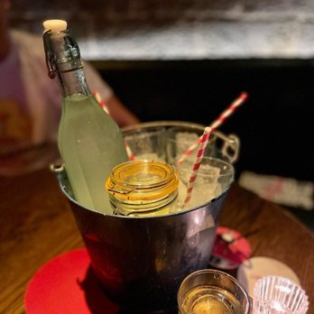 Porchlight - a bucket of drinks and a bottle of lemonade - Cocktail Bars Near Me - New York, New York Porchlight - a bucket of drinks and a bottle of lemonade - Cocktail Bars Near Me - New York, New York