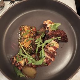 Grilled Octopus with a couscous tomato salad. It was delicious Grilled Octopus with a couscous tomato salad. It was delicious