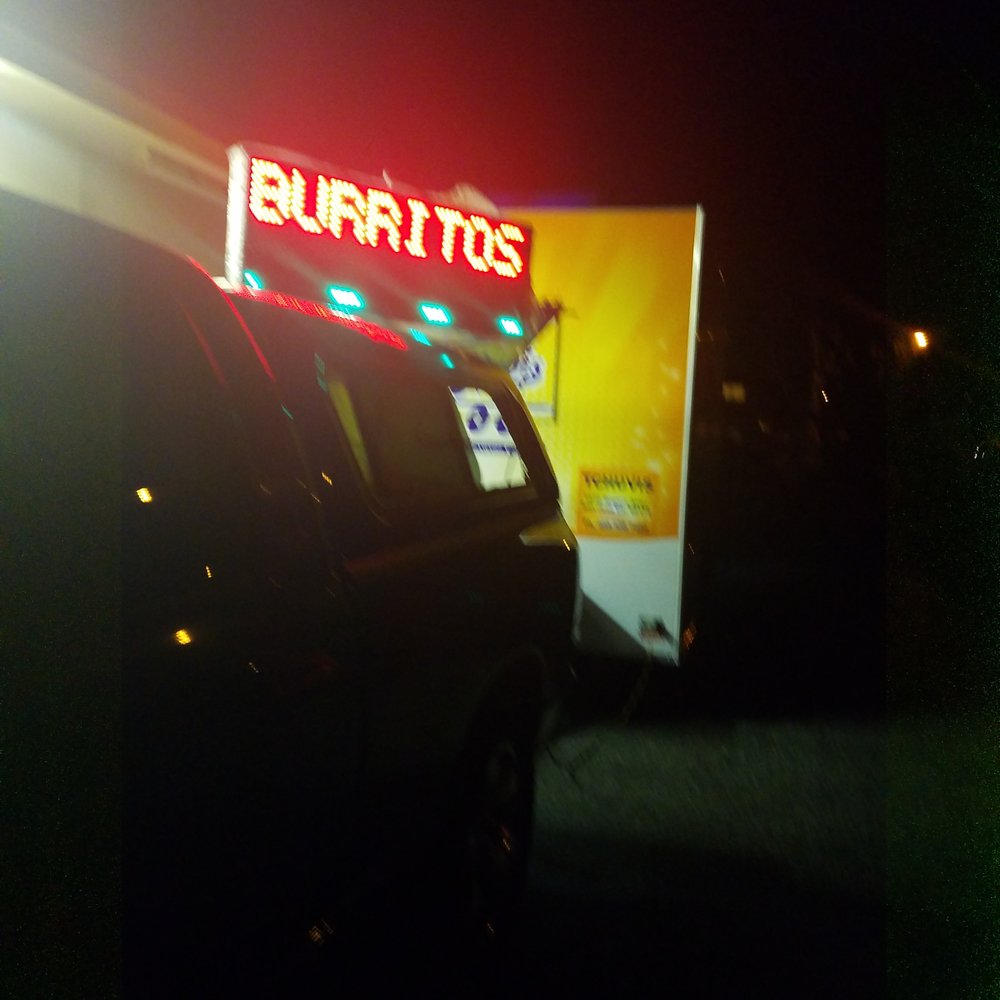TChuvis - a car parked in front of a burritos sign - Food Trucks Near Me - Sunnyvale, California TChuvis - a car parked in front of a burritos sign - Food Trucks Near Me - Sunnyvale, California