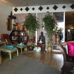 Bangkok Wellness & Spa - Interior, lounge with the massage platforms beyond the glass partition.