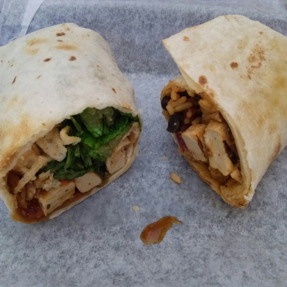 Tropical Smoothie Cafe - Thai chicken (left) and Jamaican jerk chicken made with the vegan product Beyond Meat. - Juice Bars & Smoothies Near Me - Papillion, Nebraska
