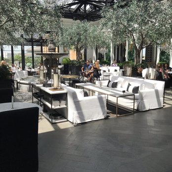 RH West Palm | The Gallery at CityPlace - Dining room under the glass ceiling - Home Decor Near Me - West Palm Beach, Florida