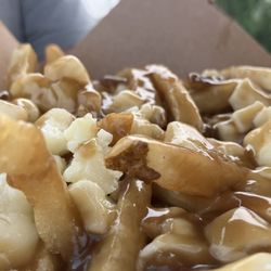 Flagship Fries - Mounds of cheese crispy fries and yummy brown gravy. Dive in!