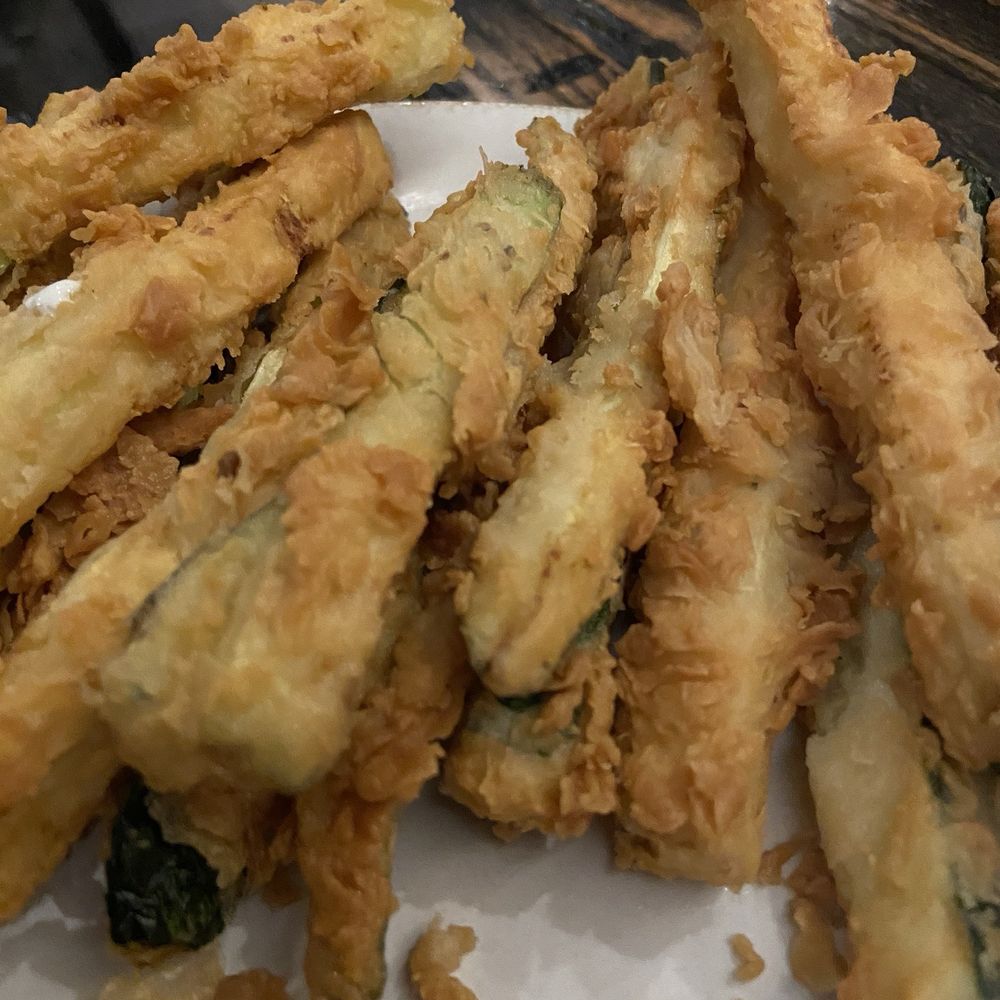 Ike’s Woodfire Grill - Half order of fried zuchinni, once again we had already ate off the plate. - American Near Me - Lubbock, Texas Ike’s Woodfire Grill - Half order of fried zuchinni, once again we had already ate off the plate. - American Near Me - Lubbock, Texas