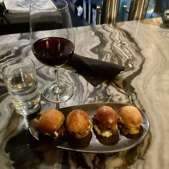 Fuhgeddaboudit - My food. Pulled pork sliders and a glass of Pinot noir. - Specialty Food Near Me - Wildomar, California