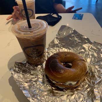 Simones Coffee & Tea - Iced Mocha with Oat Milk and a blueberry bagel with cream cheese - Coffee & Tea Near Me - Ventura, California Simones Coffee & Tea - Iced Mocha with Oat Milk and a blueberry bagel with cream cheese - Coffee & Tea Near Me - Ventura, California