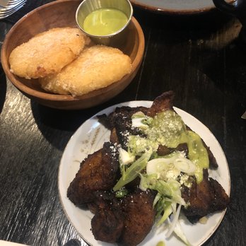Amaru - Yuca Hash Brown with Mojo Verde (left) and Sweet Plantains with Cotija & Scallions (right) - Latin American Near Me - Chicago, Illinois Amaru - Yuca Hash Brown with Mojo Verde (left) and Sweet Plantains with Cotija & Scallions (right) - Latin American Near Me - Chicago, Illinois