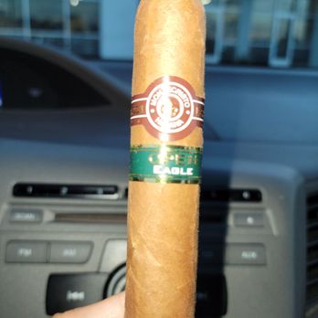 Hydeaway Cigar Club - a hand holding a cigar - Tobacco Shops Near Me - La Quinta, California Hydeaway Cigar Club - a hand holding a cigar - Tobacco Shops Near Me - La Quinta, California