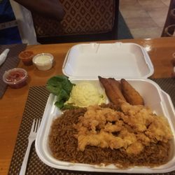 The Getaway Lounge - Having a delicious meal of cracked chicken with potato salad and plantain. A TASTE OF A BAHAMIAN EXPERIENCE.