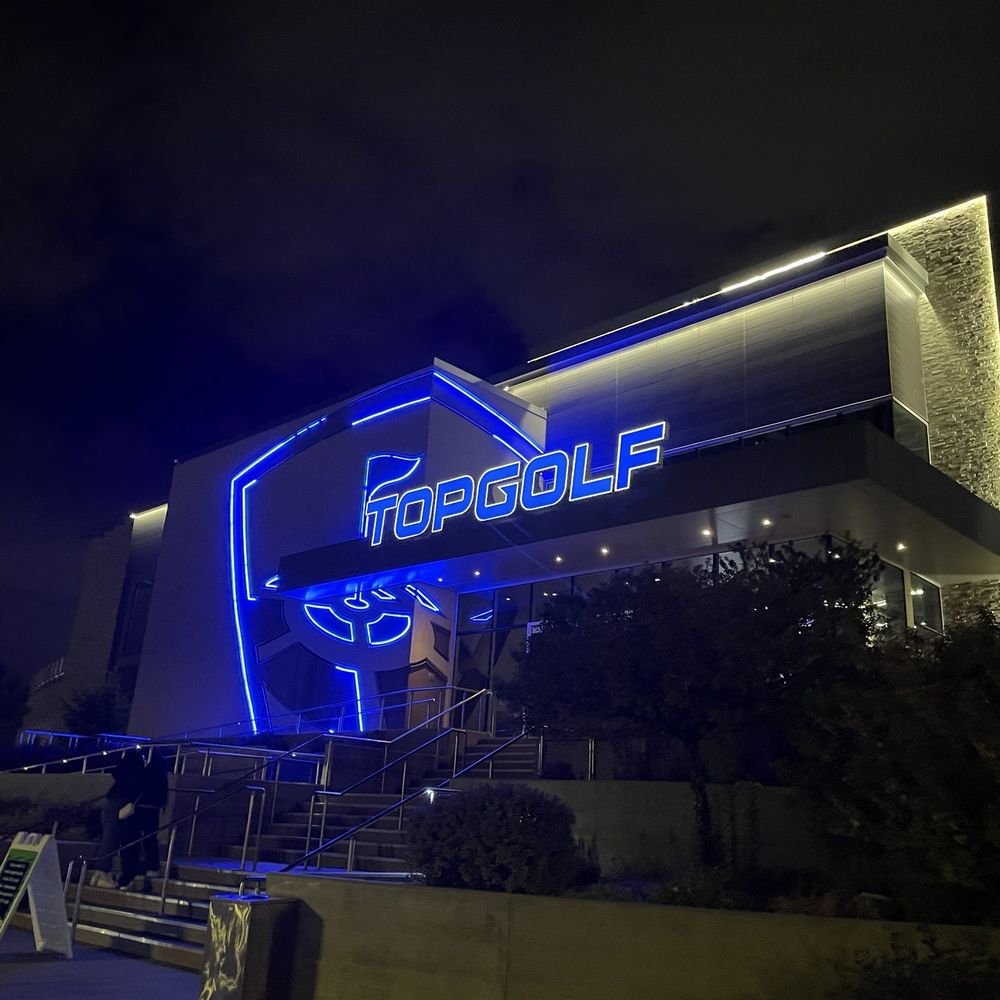 Topgolf - Exterior at nighttime. - Sports Bars Near Me - Midvale, Utah Topgolf - Exterior at nighttime. - Sports Bars Near Me - Midvale, Utah