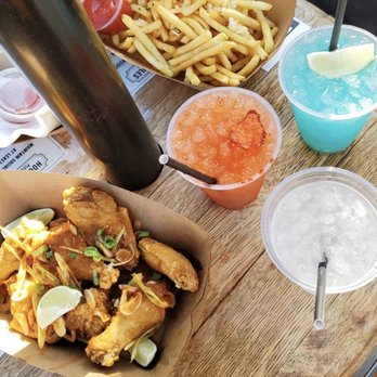 Lost and Found - Dry Fried Tom Yum Wings, Garlic Fries, Ocean Beach Mule, and Parkside Punch. - Cocktail Bars Near Me - San Francisco, California