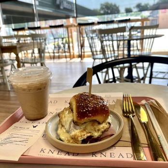 Knead Bakehouse + Provisions - Breakfast Sandwich with ham, iced chai latte - Bakeries Near Me - St. Louis, Missouri Knead Bakehouse + Provisions - Breakfast Sandwich with ham, iced chai latte - Bakeries Near Me - St. Louis, Missouri