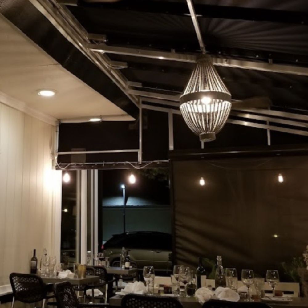 Stefano's - a dining room with a ceiling fan - Seafood Near Me - Beach Haven, New Jersey