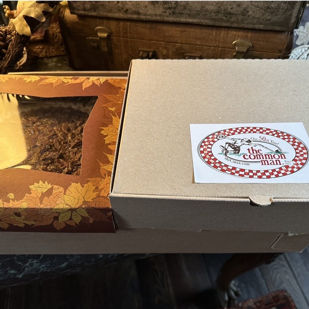 Boxed meal in sturdy perfectly sized boxes (two boxes, including box on the bottom, box on top right and extra pie on the left)