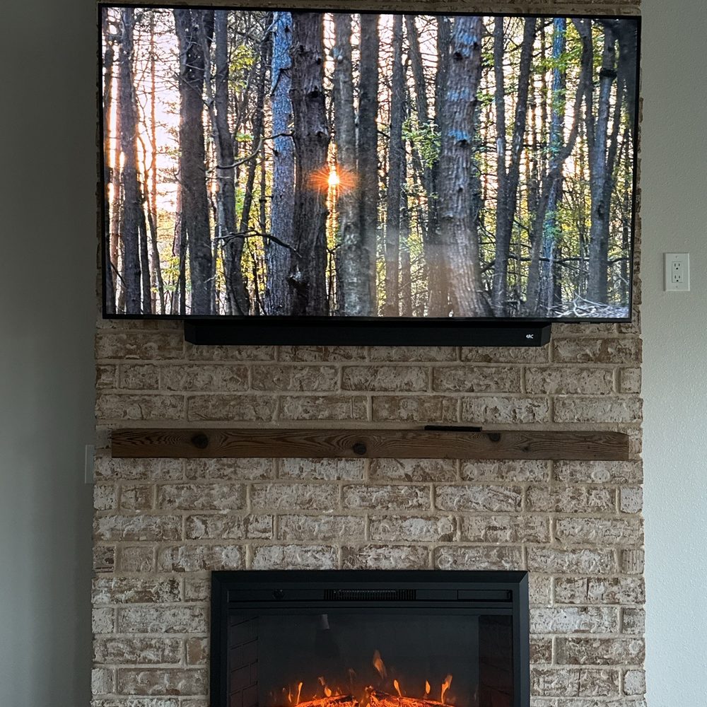 Echelon Engineered Environments - Finished setup! 65" TV + soundbar mounted on our brick fireplace wall. - Home Theatre Installation Near Me - Pharr, Texas Echelon Engineered Environments - Finished setup! 65" TV + soundbar mounted on our brick fireplace wall. - Home Theatre Installation Near Me - Pharr, Texas